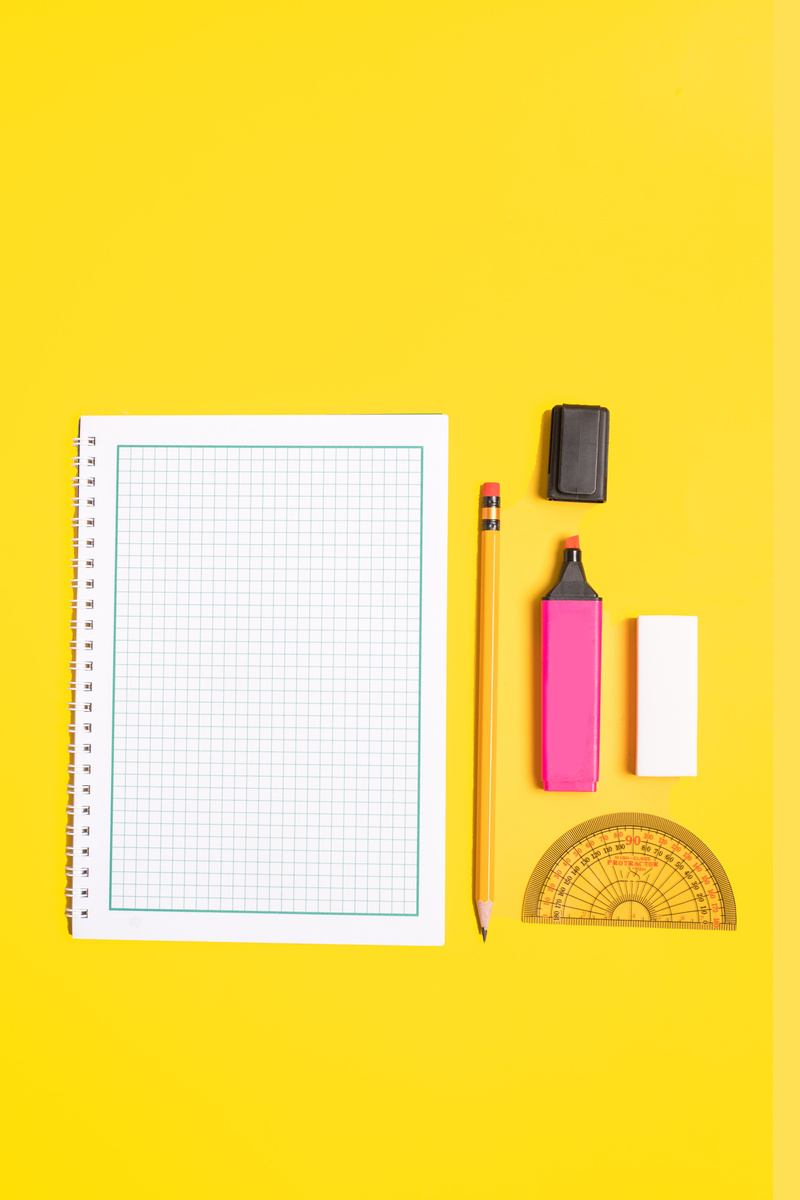 School Supplies on Yellow Background