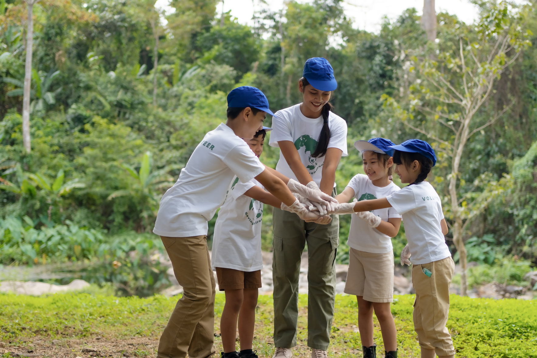 Groups of children and teachers join hands to work together to protect the environment, Save environment planet, Volunteer team.